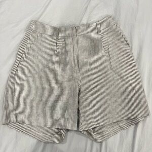 Green and white striped linen shorts. Minor staining on inner leg #linenlove